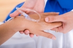 IV drip attached to woman's hand