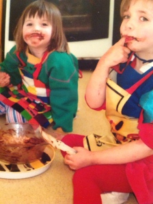 children licking cake mix from a bowl