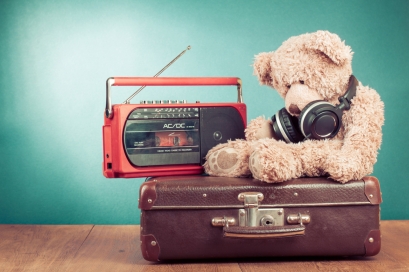 teddy with headphones, radio and suitcase