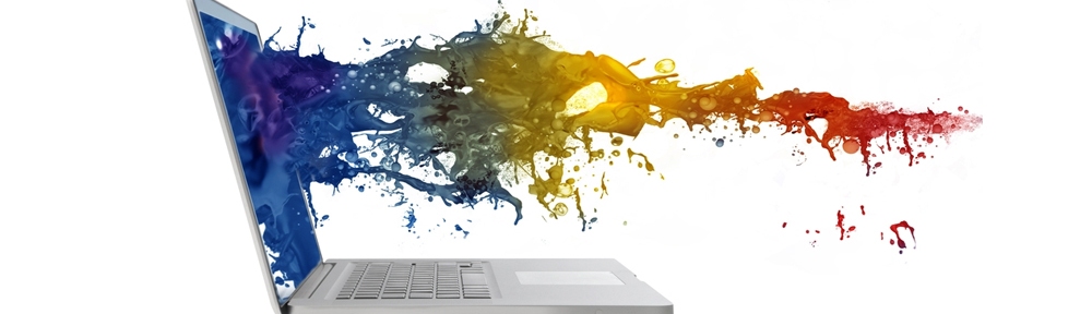 laptop with coloured ink coming out